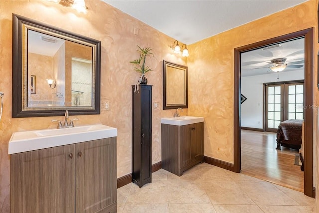 bathroom featuring french doors, tile patterned floors, vanity, and ceiling fan