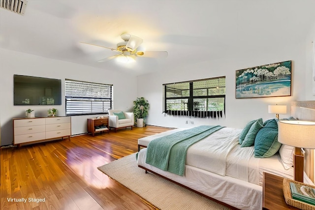 bedroom with hardwood / wood-style floors and ceiling fan