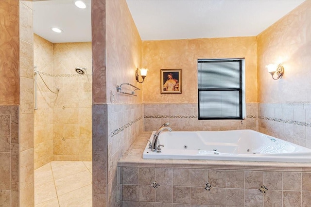 bathroom with tile patterned flooring and shower with separate bathtub