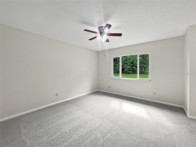 spare room with a textured ceiling, ceiling fan, and carpet floors