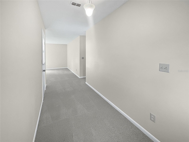 hallway featuring carpet flooring