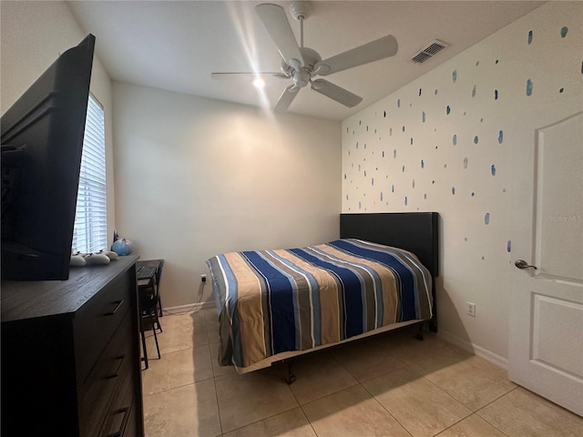 bedroom featuring ceiling fan and light tile patterned floors