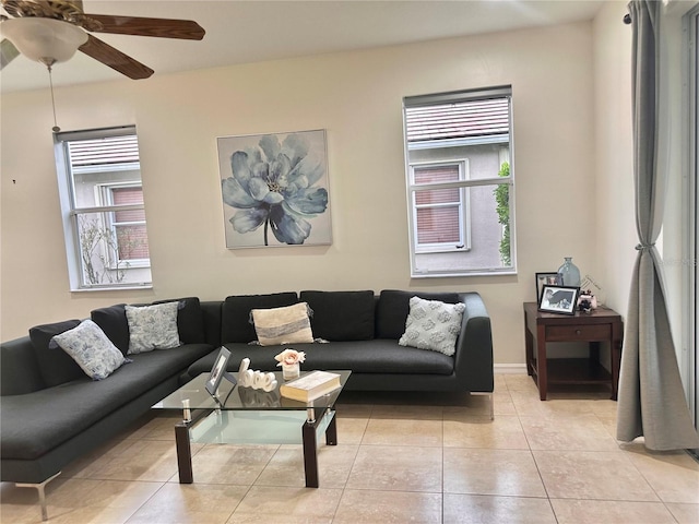 tiled living room featuring ceiling fan