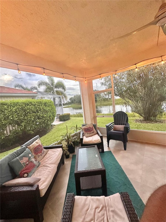 view of patio / terrace featuring an outdoor living space and a water view