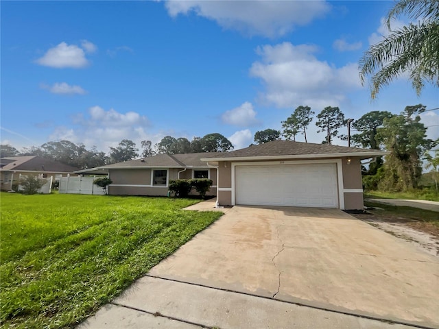 single story home featuring a front yard and a garage