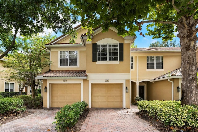 mediterranean / spanish-style home featuring a garage