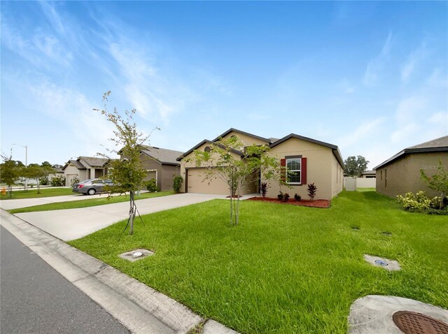 ranch-style house featuring a front yard and a garage