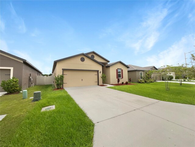 ranch-style home with a front lawn and a garage