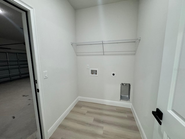 washroom featuring washer hookup, light hardwood / wood-style floors, and electric dryer hookup