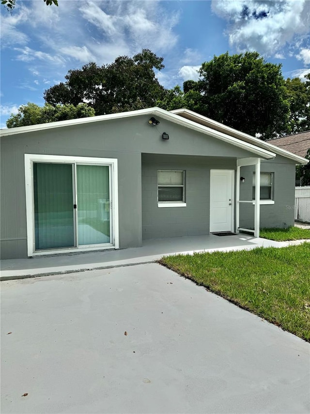 rear view of house with a lawn