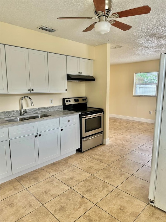 kitchen with a textured ceiling, sink, white cabinetry, ceiling fan, and stainless steel range with electric cooktop