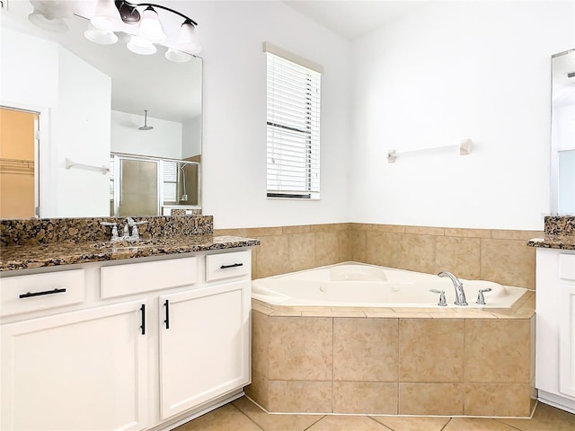 bathroom with vanity, plus walk in shower, and tile patterned flooring