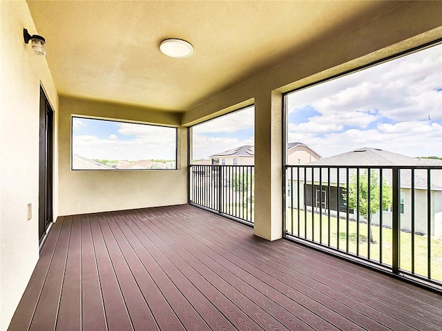 unfurnished sunroom with a wealth of natural light