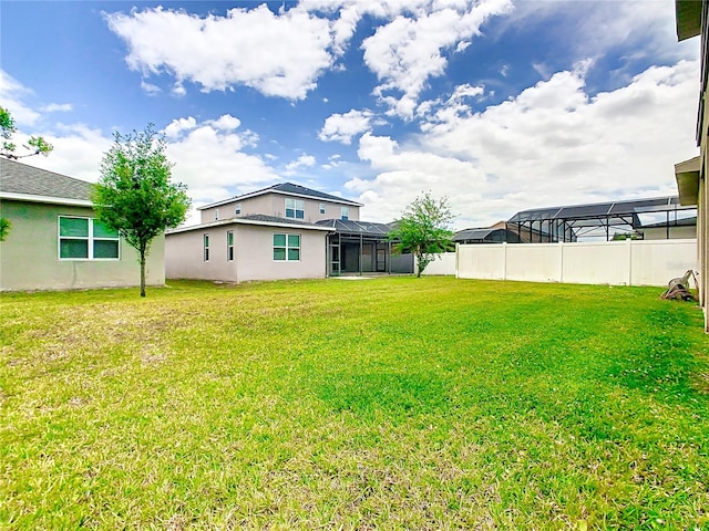 view of yard featuring a lanai