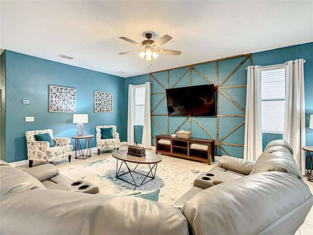 1471 Rolling Fairway Dr, Davenport, FL 33896 - living area featuring ceiling fan, an accent wall, visible vents, carpet floors, and baseboards