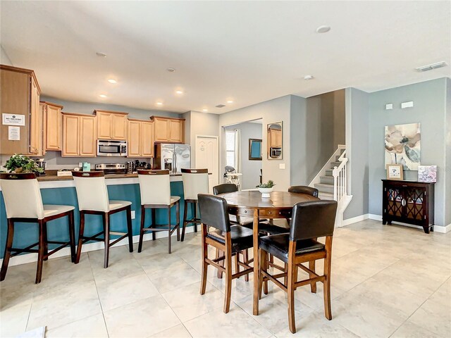 1471 Rolling Fairway Dr, Davenport, FL 33896 - dining space with visible vents, baseboards, recessed lighting, stairs, and light tile patterned flooring