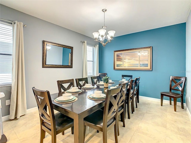 dining space featuring a chandelier