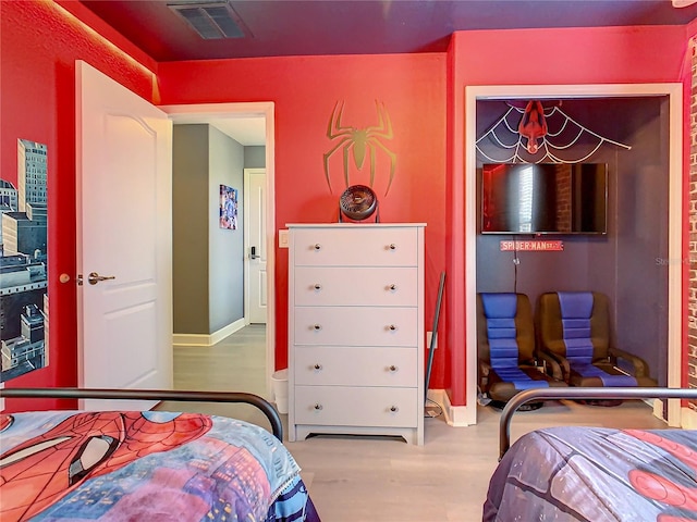 bedroom featuring hardwood / wood-style flooring