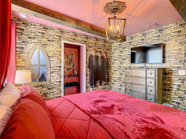 bedroom with an inviting chandelier