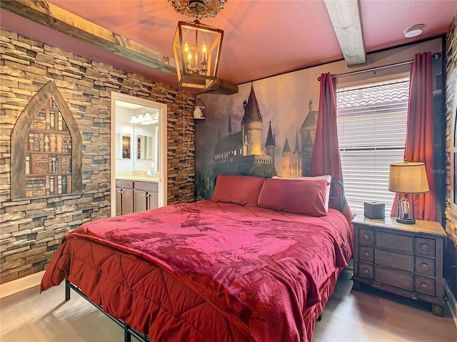1471 Rolling Fairway Dr, Davenport, FL 33896 - bedroom with beam ceiling, connected bathroom, and an inviting chandelier