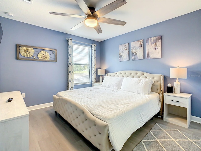 bedroom featuring ceiling fan and wood-type flooring