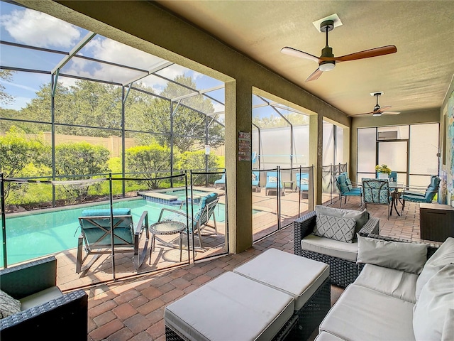 view of patio / terrace with an outdoor living space, glass enclosure, a pool with hot tub, and ceiling fan