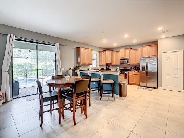 1471 Rolling Fairway Dr, Davenport, FL 33896 - dining space featuring recessed lighting, light tile patterned floors, visible vents, and a healthy amount of sunlight