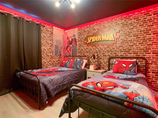 bedroom with brick wall