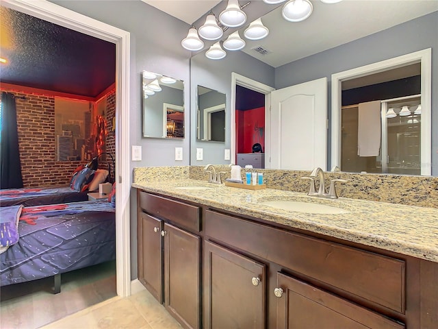 bathroom with tile patterned flooring and vanity