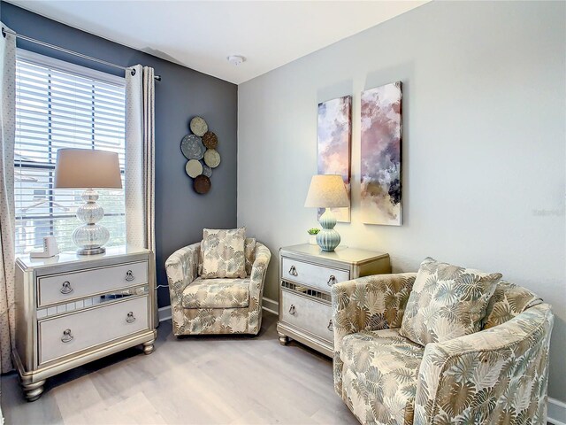 1471 Rolling Fairway Dr, Davenport, FL 33896 - sitting room featuring baseboards and wood finished floors