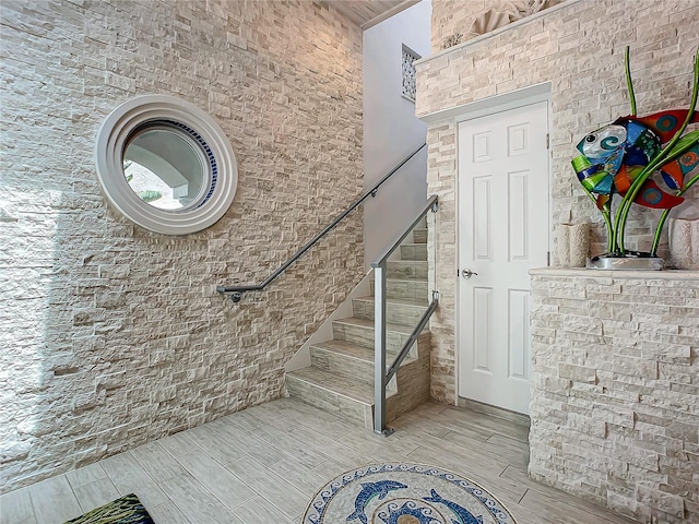 stairs featuring hardwood / wood-style floors