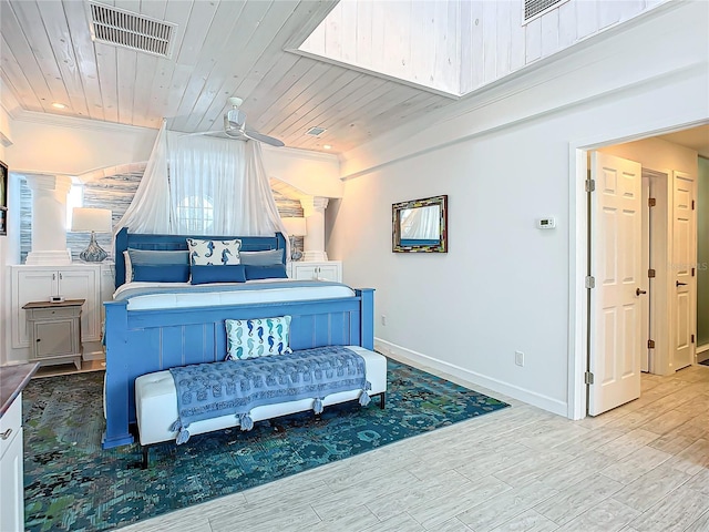 bedroom with wood ceiling, light hardwood / wood-style flooring, and ornamental molding