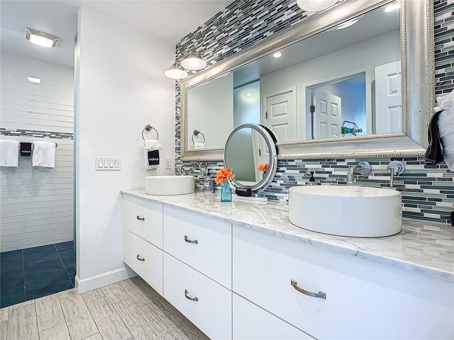 bathroom with vanity and backsplash