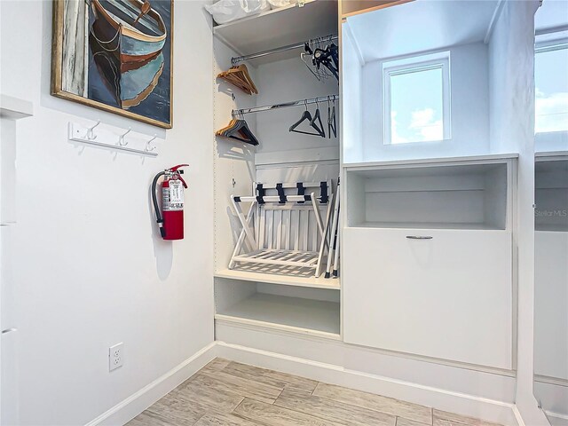 mudroom featuring wood-type flooring and plenty of natural light