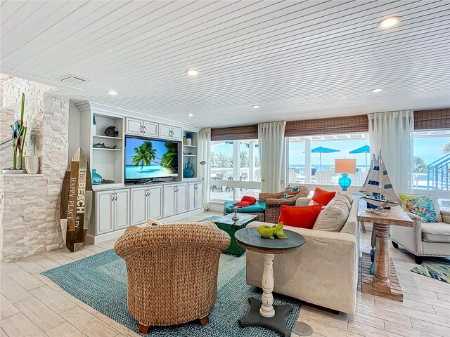 living room with wood ceiling and light hardwood / wood-style flooring