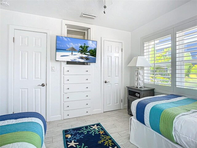 bedroom with light wood-type flooring