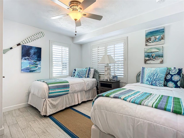 bedroom featuring light wood-type flooring and ceiling fan