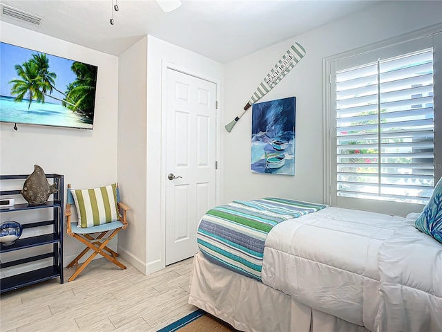 bedroom featuring ceiling fan and light hardwood / wood-style floors