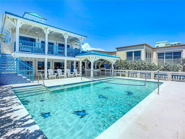 view of swimming pool featuring a patio area and a gazebo