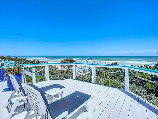 wooden deck featuring a water view