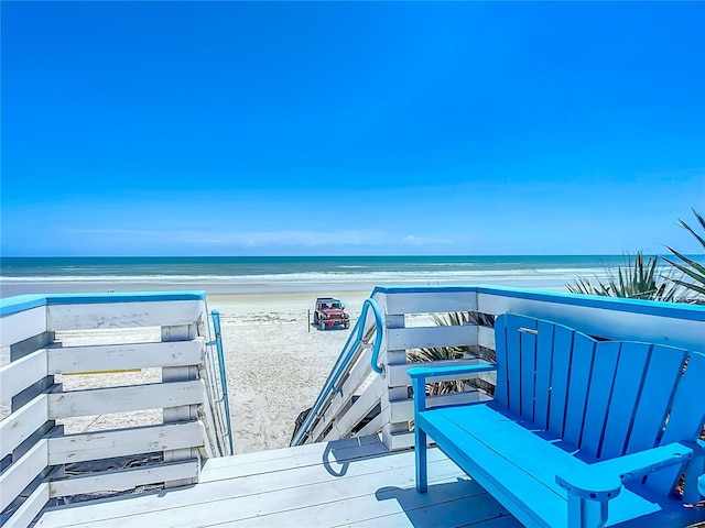 view of property's community featuring a view of the beach and a water view