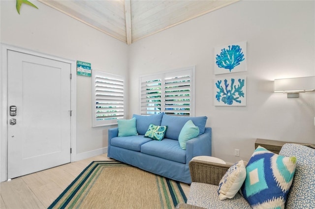 living room with wood-type flooring and vaulted ceiling