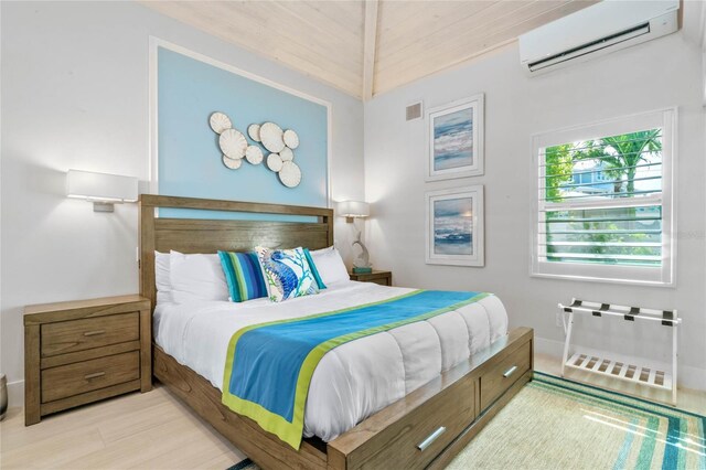 bedroom with wood ceiling, light hardwood / wood-style flooring, and a wall mounted air conditioner