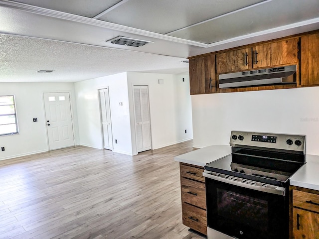 kitchen featuring a textured ceiling, light wood-type flooring, stainless steel electric range oven, and extractor fan