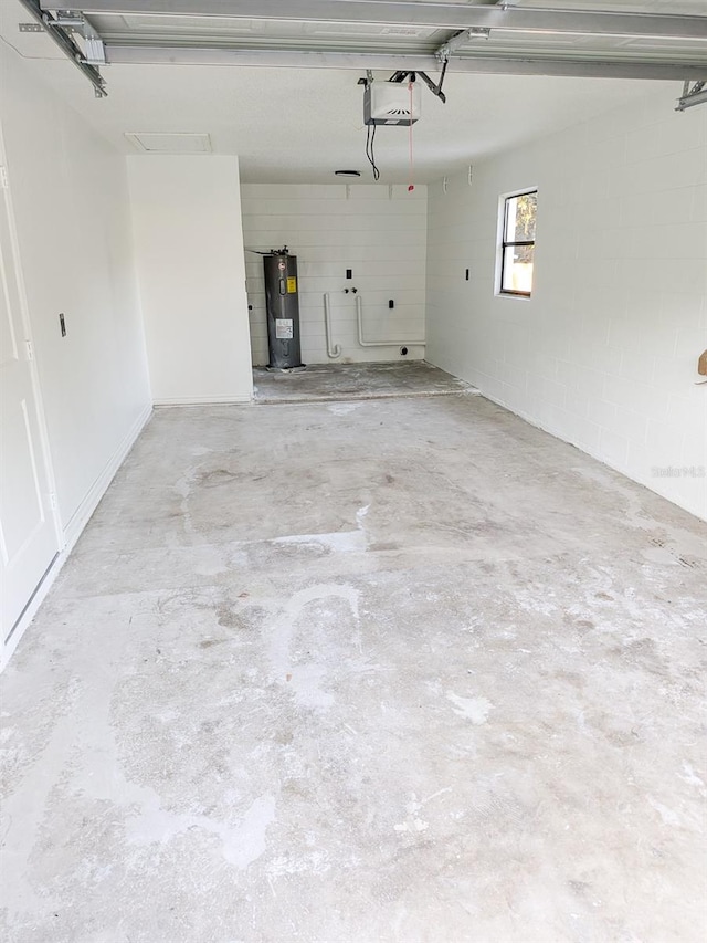 garage with a garage door opener and water heater