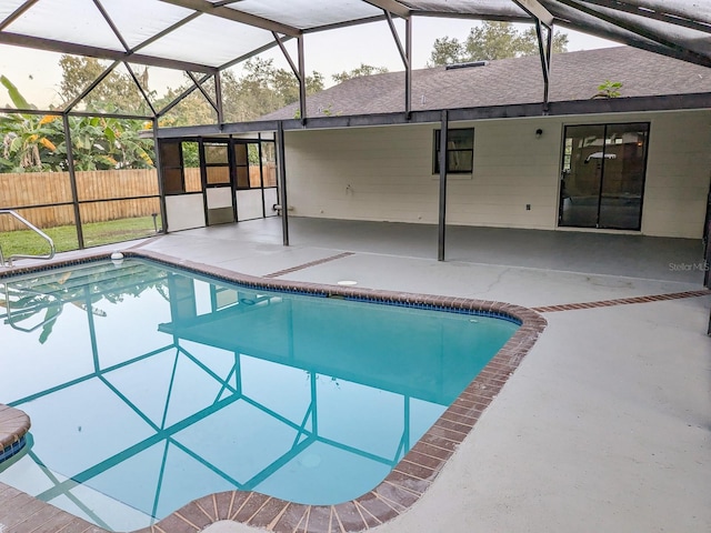 view of pool featuring a lanai and a patio area