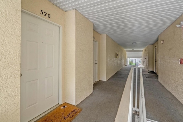 hallway featuring carpet flooring