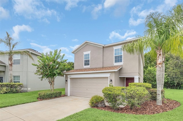 view of front facade with a garage and a front yard