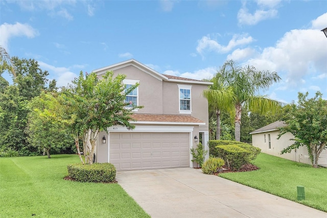 view of front of house featuring a garage and a front lawn