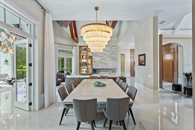 dining room featuring a notable chandelier and beam ceiling